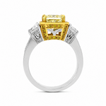 Load image into Gallery viewer, A yellow gold and white gold ring with a large rectangular yellow center stone and smaller accent stones, shown on a plain white background.