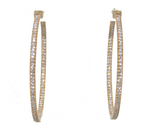 Load image into Gallery viewer, A pair of gold hoop earrings paved with small clear stones, shown against a plain white background.