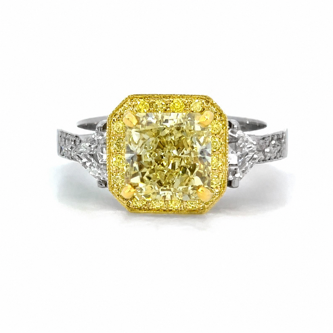 Platinum and 18K Yellow Gold 3-Stone Yellow Diamond Halo Ring
