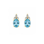Load image into Gallery viewer, 14K Yellow Gold Oval Blue Topaz and Diamond Stud Earrings
