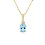 Load image into Gallery viewer, 14K Yellow Gold Oval Blue Topaz and Diamond Pendant